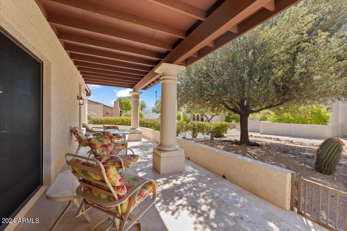 18425 East 4 Peaks Boulevard Rio Verde, AZ 85263 - Photo 40 of 75 a view of a porch with furniture and a backyard