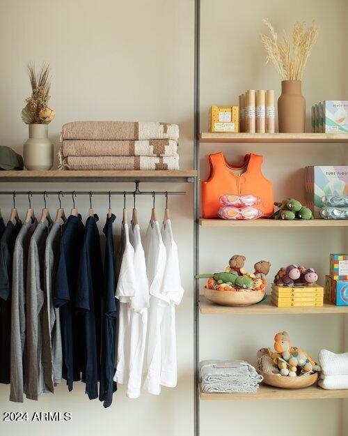 18425 East 4 Peaks Boulevard Rio Verde, AZ 85263 - Photo 73 of 75 a front view of a room with lots of different colored cloths