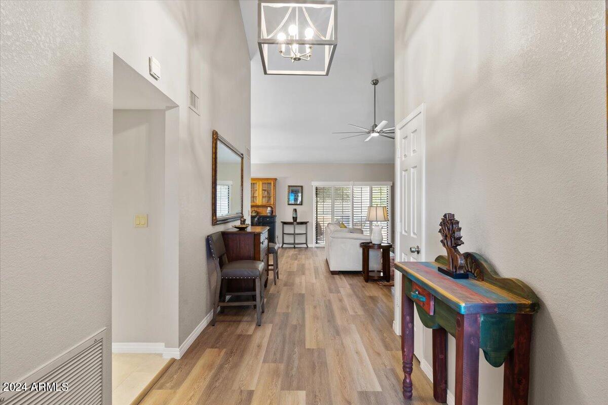 18425 East 4 Peaks Boulevard Rio Verde, AZ 85263 - Photo 8 of 75 a living room with furniture and a wooden floor
