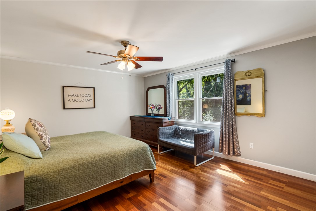 512 East Fredericks Street Anderson, SC 29621 - Photo 13 of 31 Sun-filled bedroom features rich hardwood flooring and a refreshing ceiling fan.