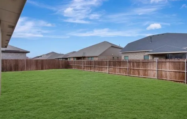 a view of a yard in front of a house