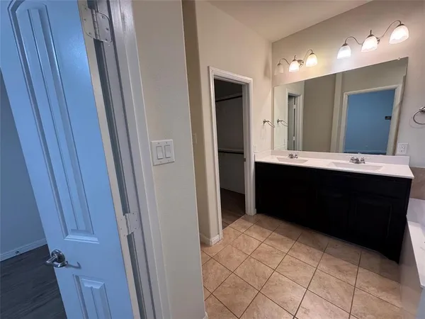 a bathroom with a sink a vanity and a mirror
