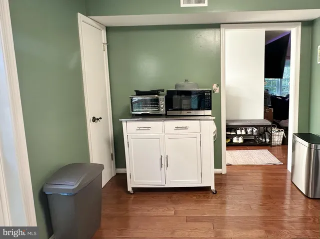 a kitchen with stainless steel appliances a white stove top oven and a refrigerator
