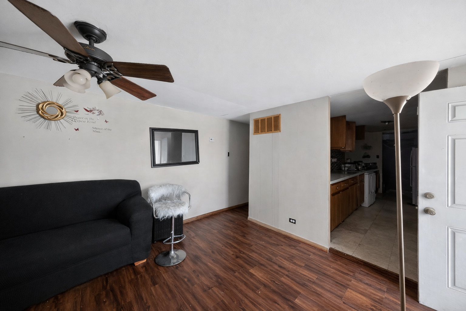 2711 West 165th Street Markham, IL 60428 - Photo 5 of 14 a living room with furniture and a wooden floor