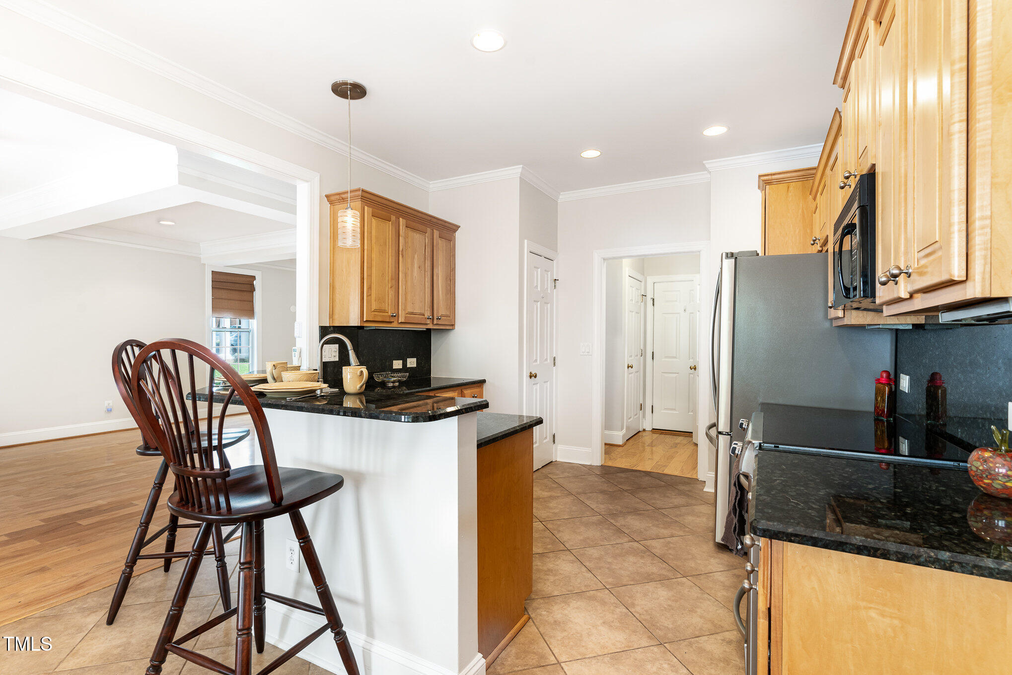 4060 Barton Park Place Raleigh, NC 27613 - Photo 14 of 38 a living room with stainless steel appliances kitchen island granite countertop furniture and a kitchen view