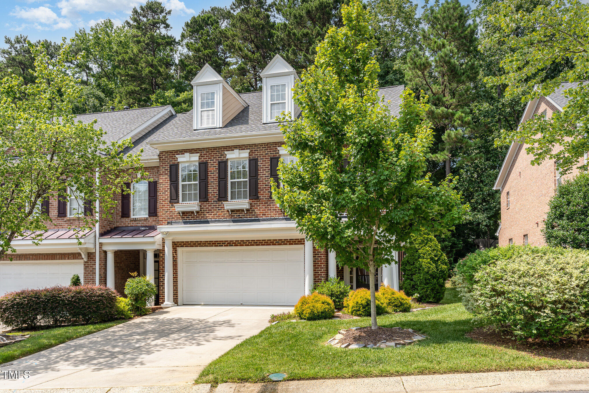 4060 Barton Park Place Raleigh, NC 27613 - Photo 2 of 38 a front view of a house with garden and trees
