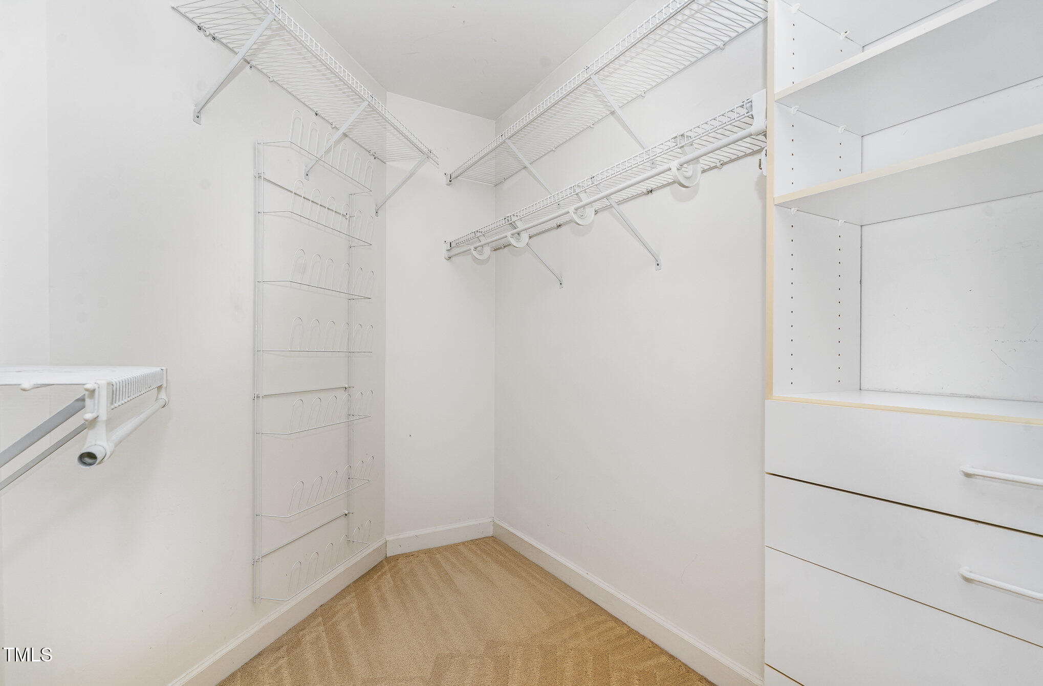4060 Barton Park Place Raleigh, NC 27613 - Photo 29 of 38 a view of a room with racks on the wall
