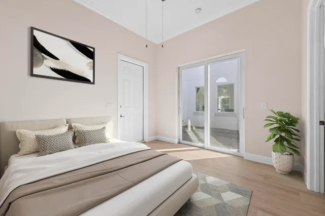 an empty space with wooden floor and mirror