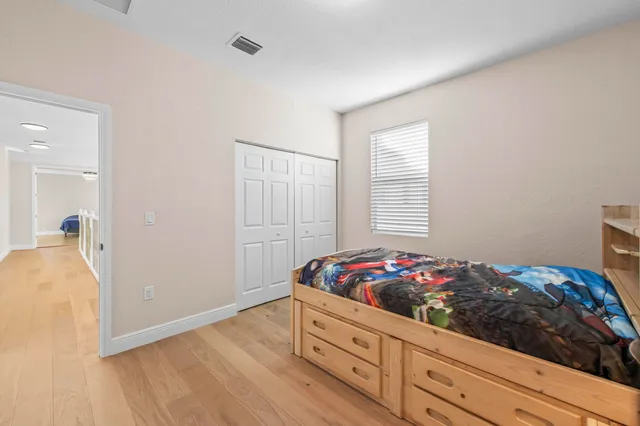 a bedroom with a bed and a table