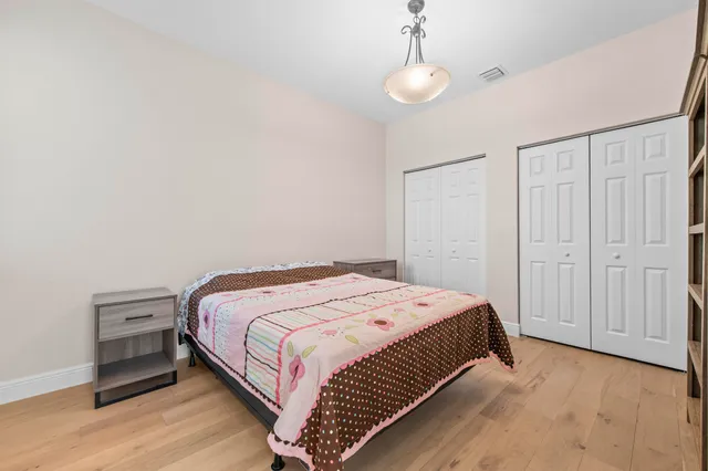 a bathroom with a granite countertop sink a toilet and bathtub