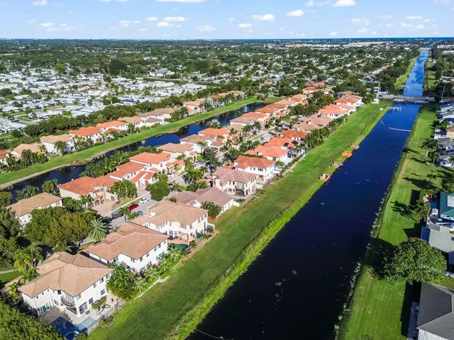 an aerial view of residential houses and outdoor space