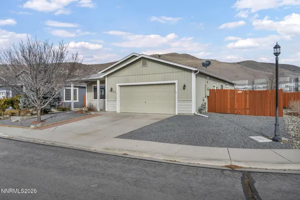 a front view of a house with a garage