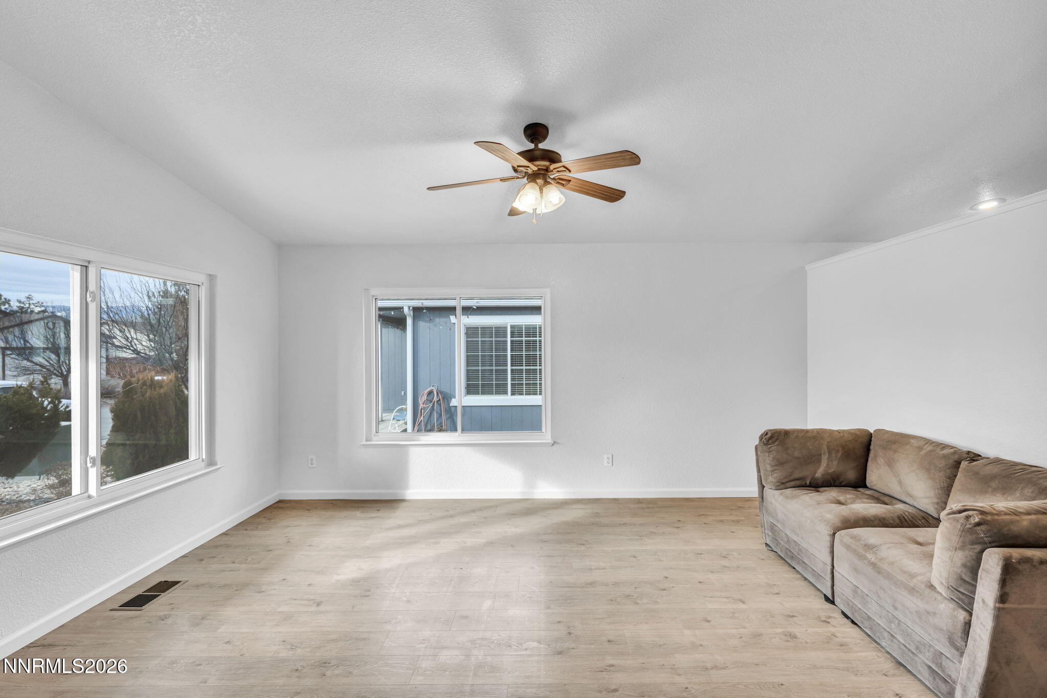17725 Live Oak Court Reno, NV 89508 - Photo 20 of 44 a living room with furniture and a window