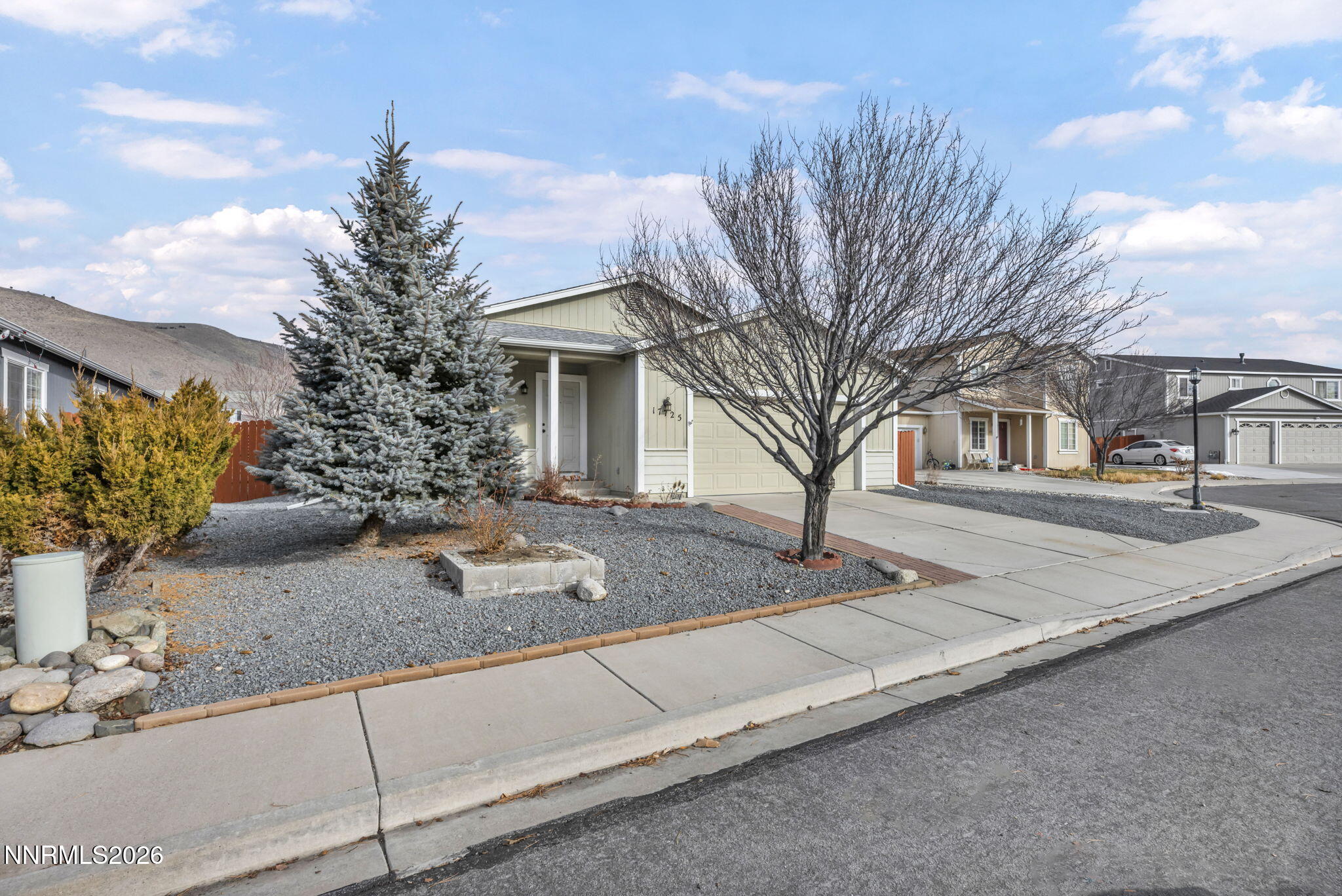 17725 Live Oak Court Reno, NV 89508 - Photo 2 of 44 a front view of a house with garden