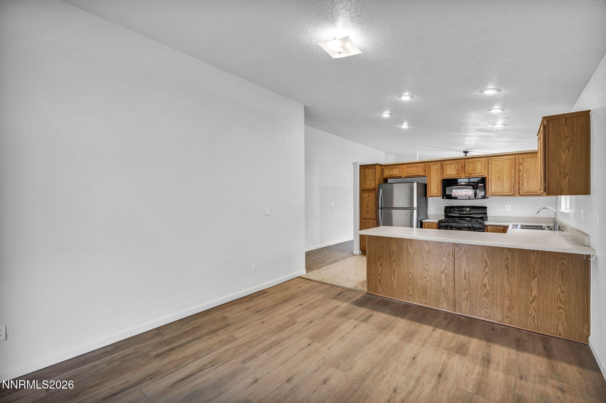 17725 Live Oak Court Reno, NV 89508 - Photo 25 of 44 a kitchen with stainless steel appliances a refrigerator and a stove top oven