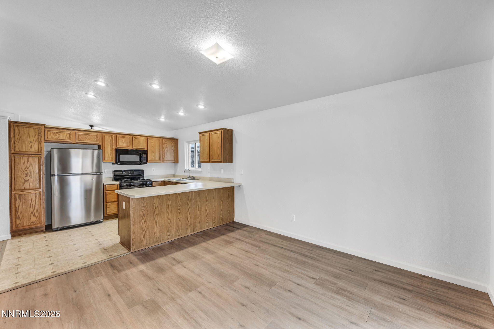 17725 Live Oak Court Reno, NV 89508 - Photo 30 of 44 a view of kitchen with stainless steel appliances wooden floor and large window