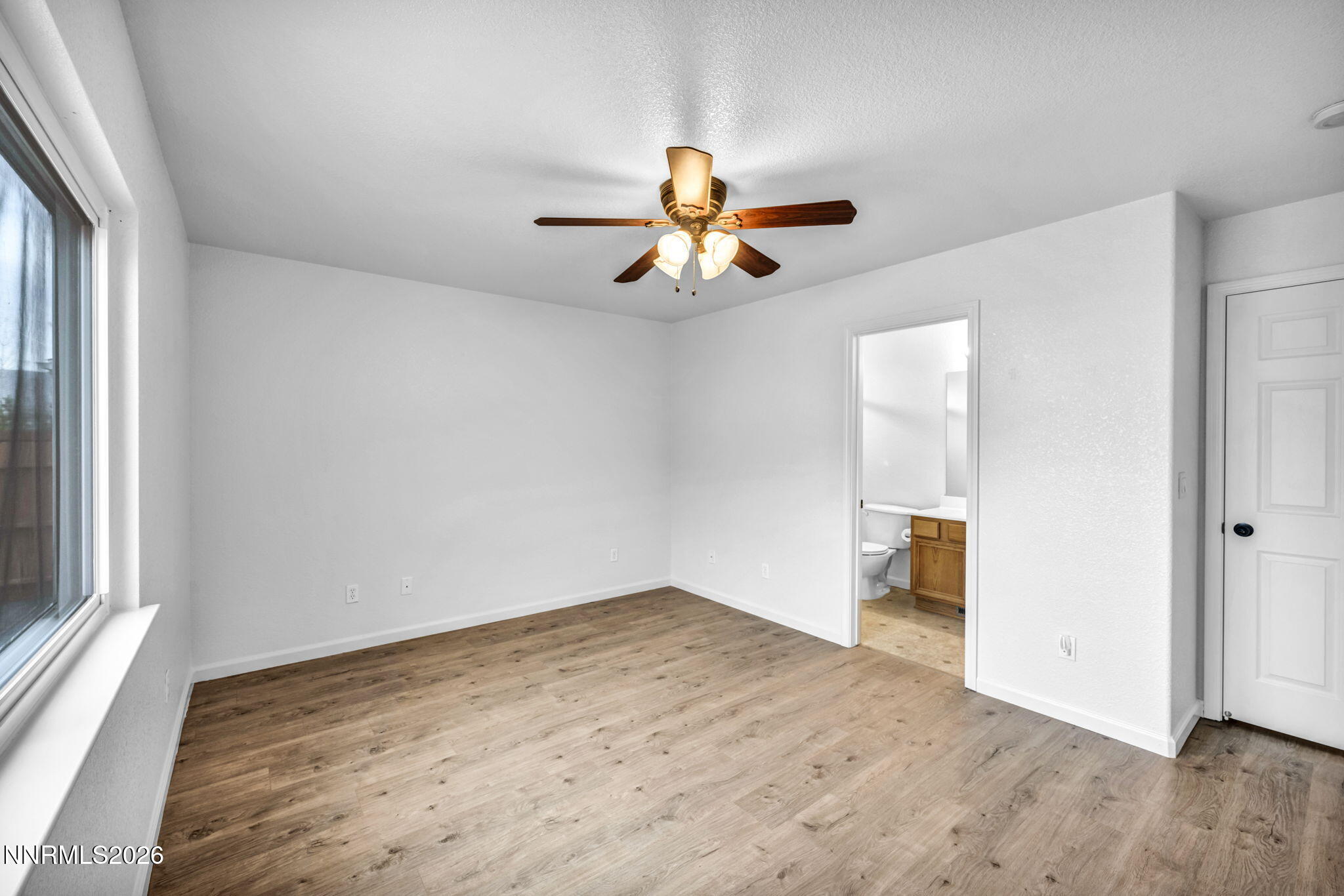 17725 Live Oak Court Reno, NV 89508 - Photo 33 of 44 a view of empty room with wooden floor and fan