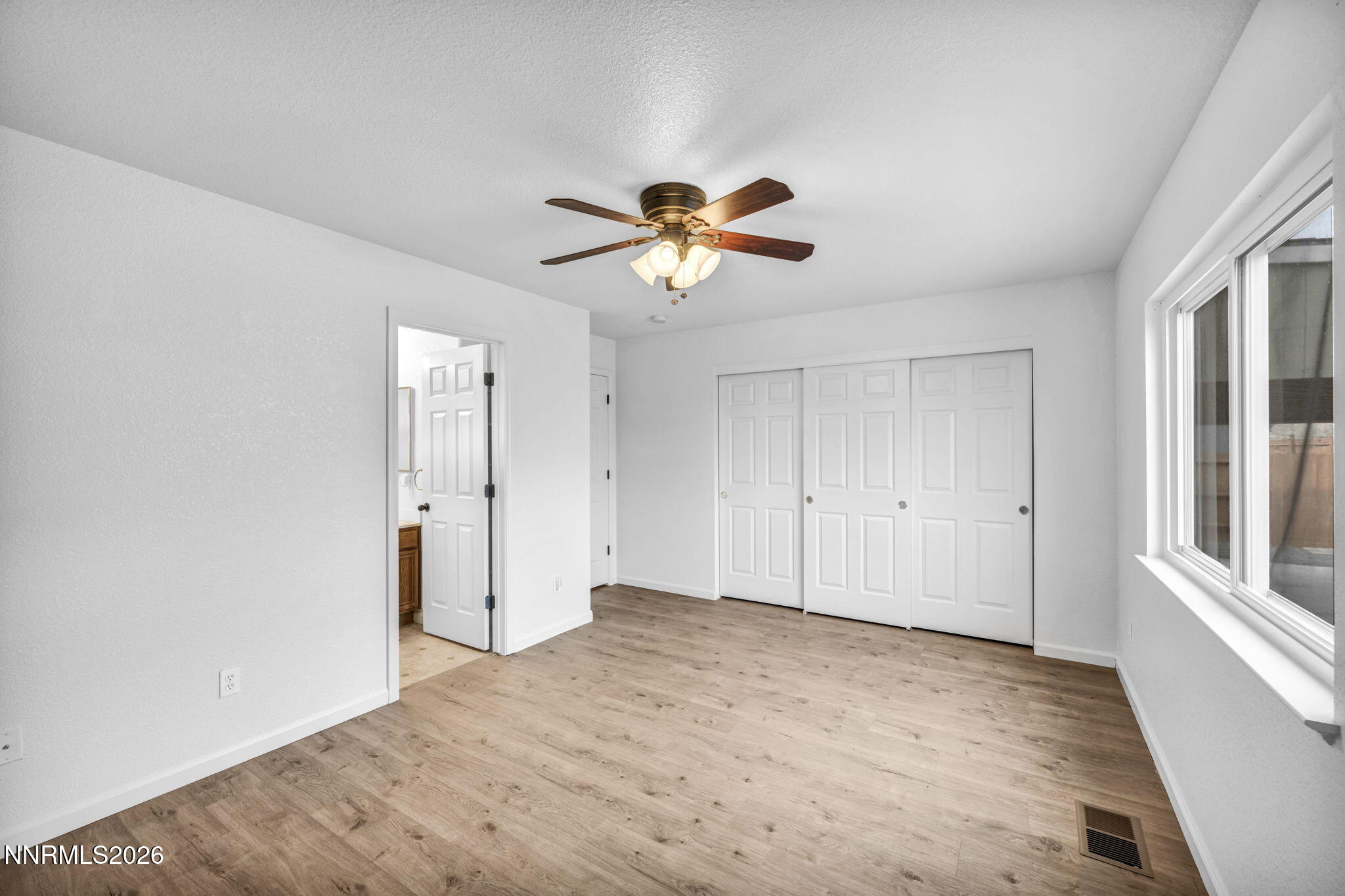 17725 Live Oak Court Reno, NV 89508 - Photo 34 of 44 a view of a room with a ceiling fan and a window
