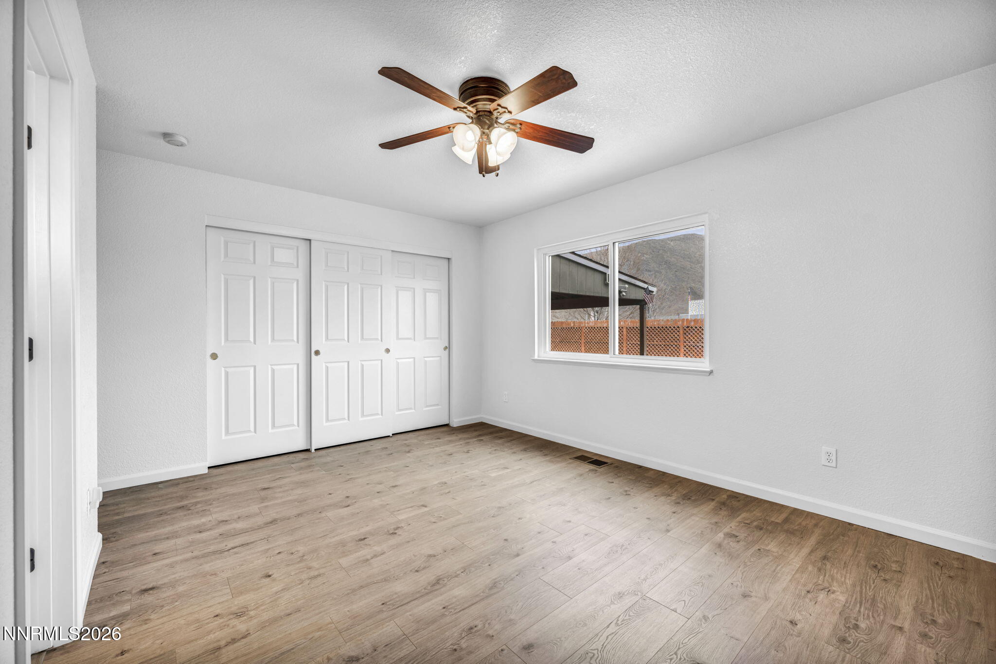 17725 Live Oak Court Reno, NV 89508 - Photo 35 of 44 wooden floor in an empty room with a window