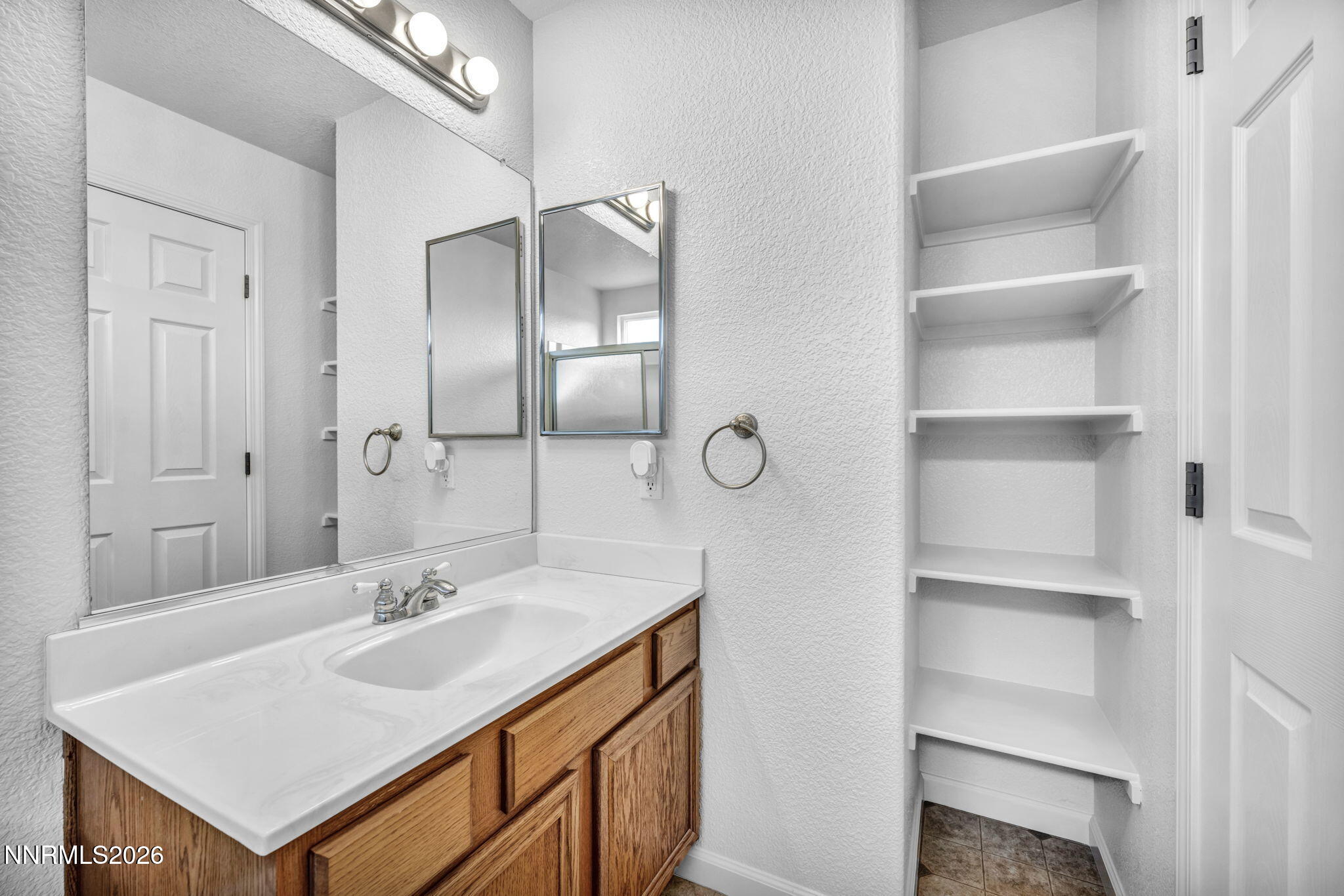 17725 Live Oak Court Reno, NV 89508 - Photo 37 of 44 a bathroom with a sink and a mirror