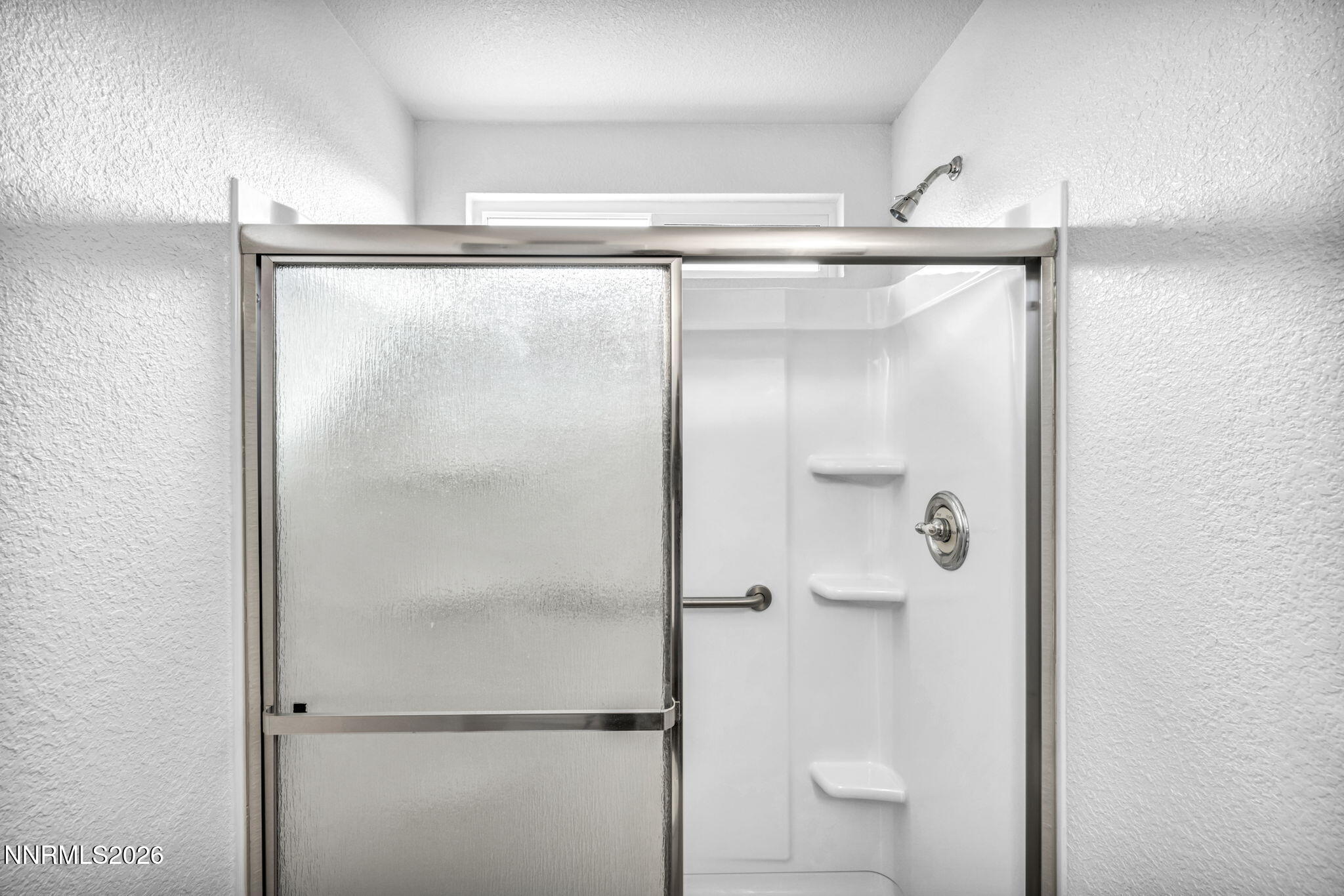 17725 Live Oak Court Reno, NV 89508 - Photo 38 of 44 a bathroom with a glass shower door