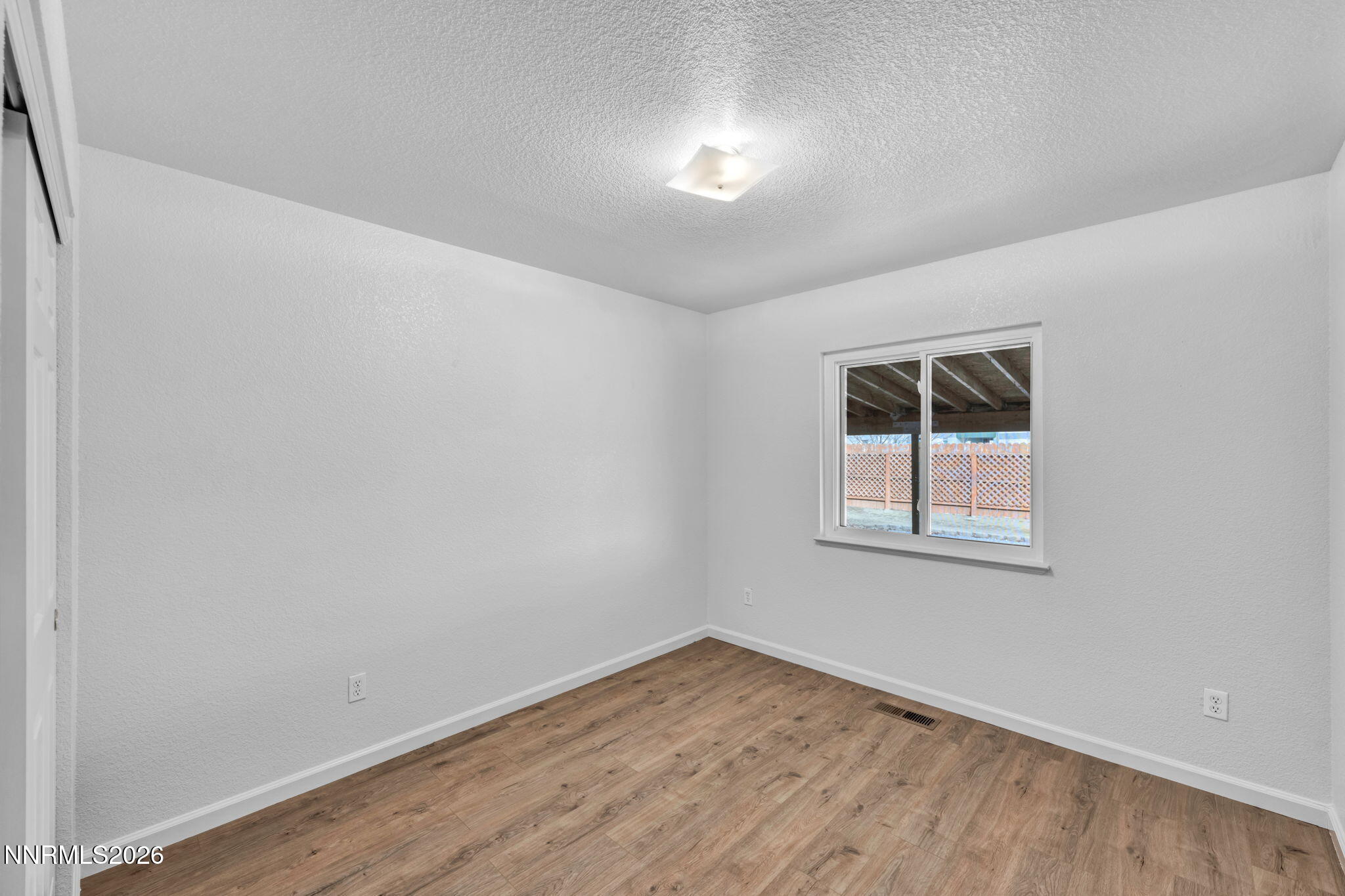 17725 Live Oak Court Reno, NV 89508 - Photo 41 of 44 a view of empty room with wooden floor