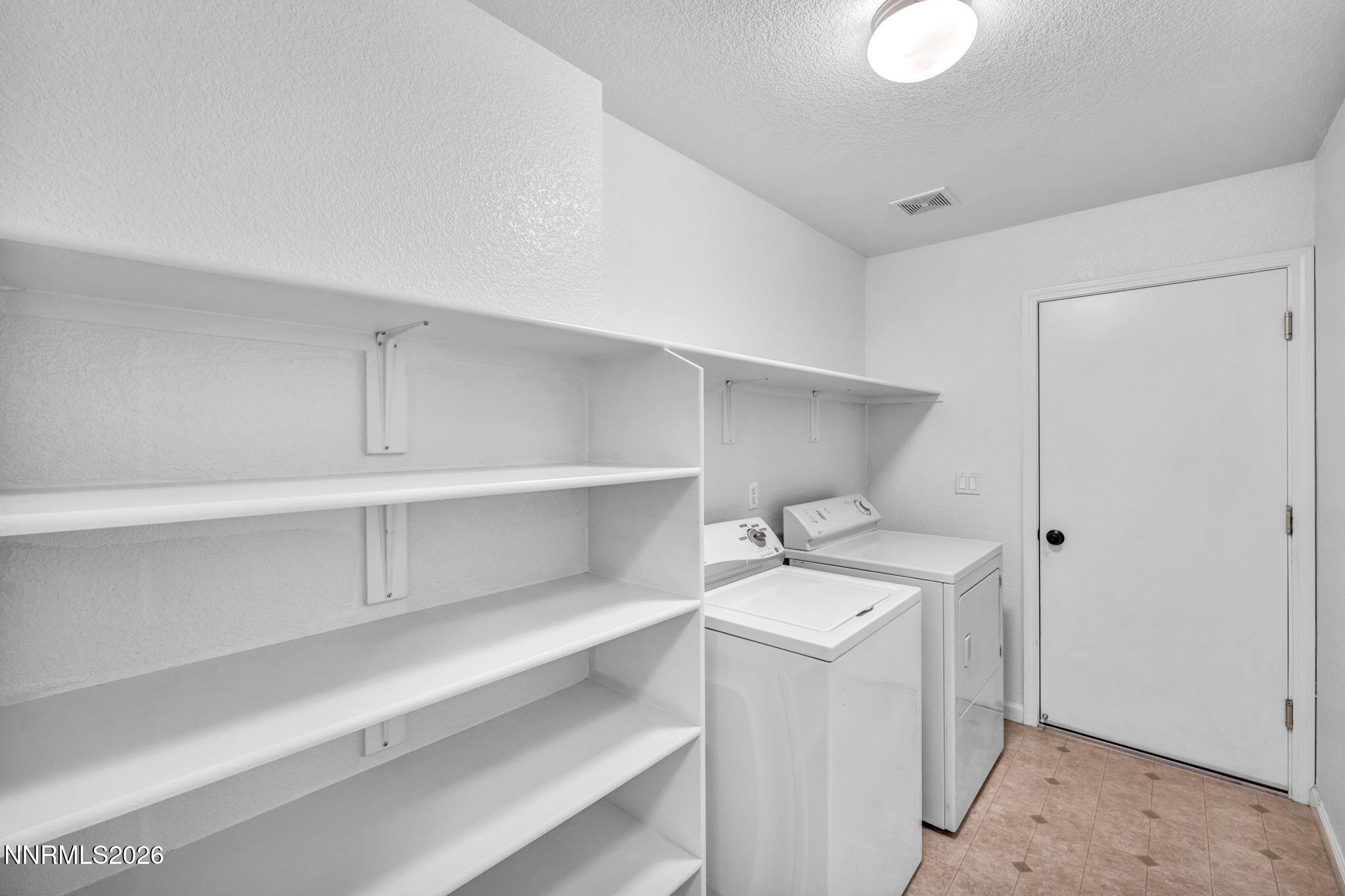 17725 Live Oak Court Reno, NV 89508 - Photo 44 of 44 a utility room with multiple dryer and washer