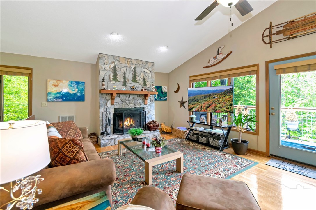 1078 Charter Hills Road Beech Mountain, NC 28604 - Photo 14 of 50 a living room with furniture large window and a fireplace