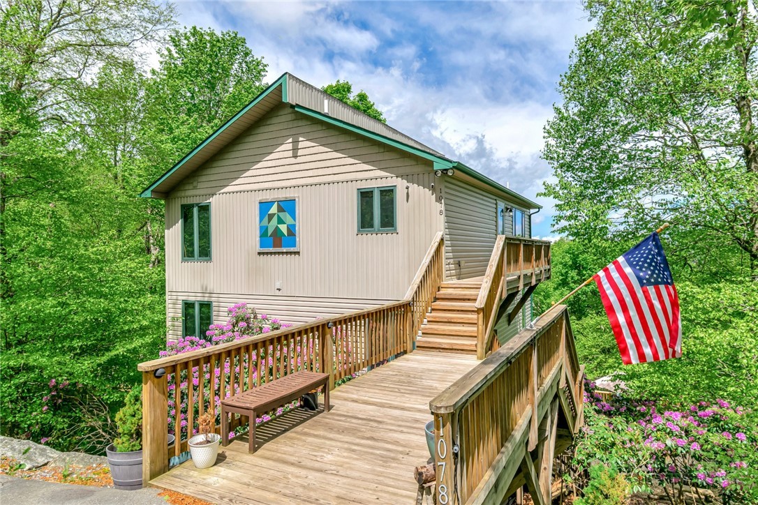 1078 Charter Hills Road Beech Mountain, NC 28604 - Photo 2 of 50 a view of a house with a yard
