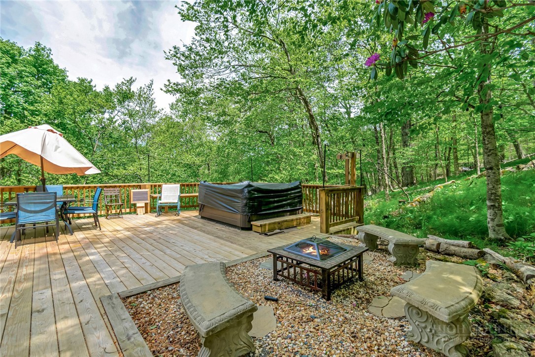 1078 Charter Hills Road Beech Mountain, NC 28604 - Photo 44 of 50 an outdoor space with patio and couches