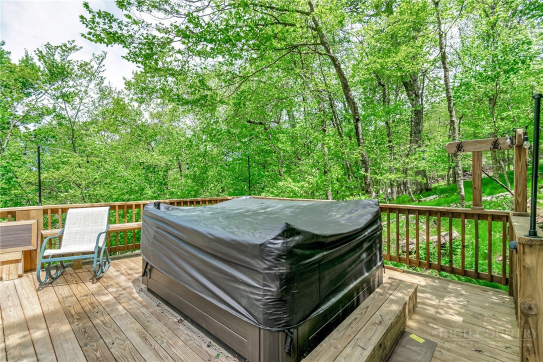 1078 Charter Hills Road Beech Mountain, NC 28604 - Photo 45 of 50 a view of a patio with two chairs and a table