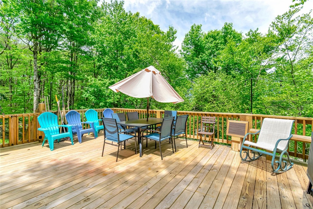 1078 Charter Hills Road Beech Mountain, NC 28604 - Photo 46 of 50 an outdoor space with furniture and umbrella