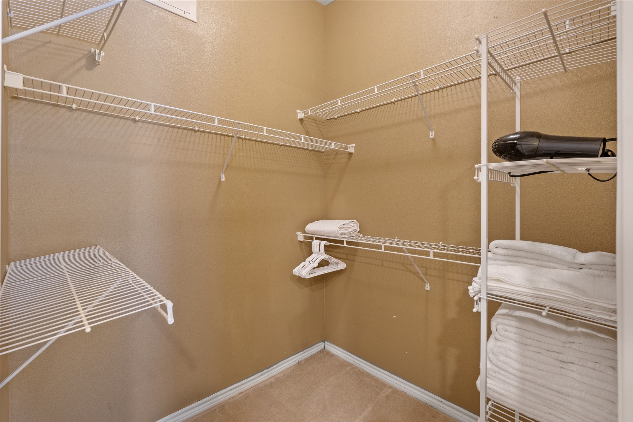 2400 McCue Road, Unit 218 Houston, TX 77056 - Photo 12 of 16 Closet has hanging and stackable areas.