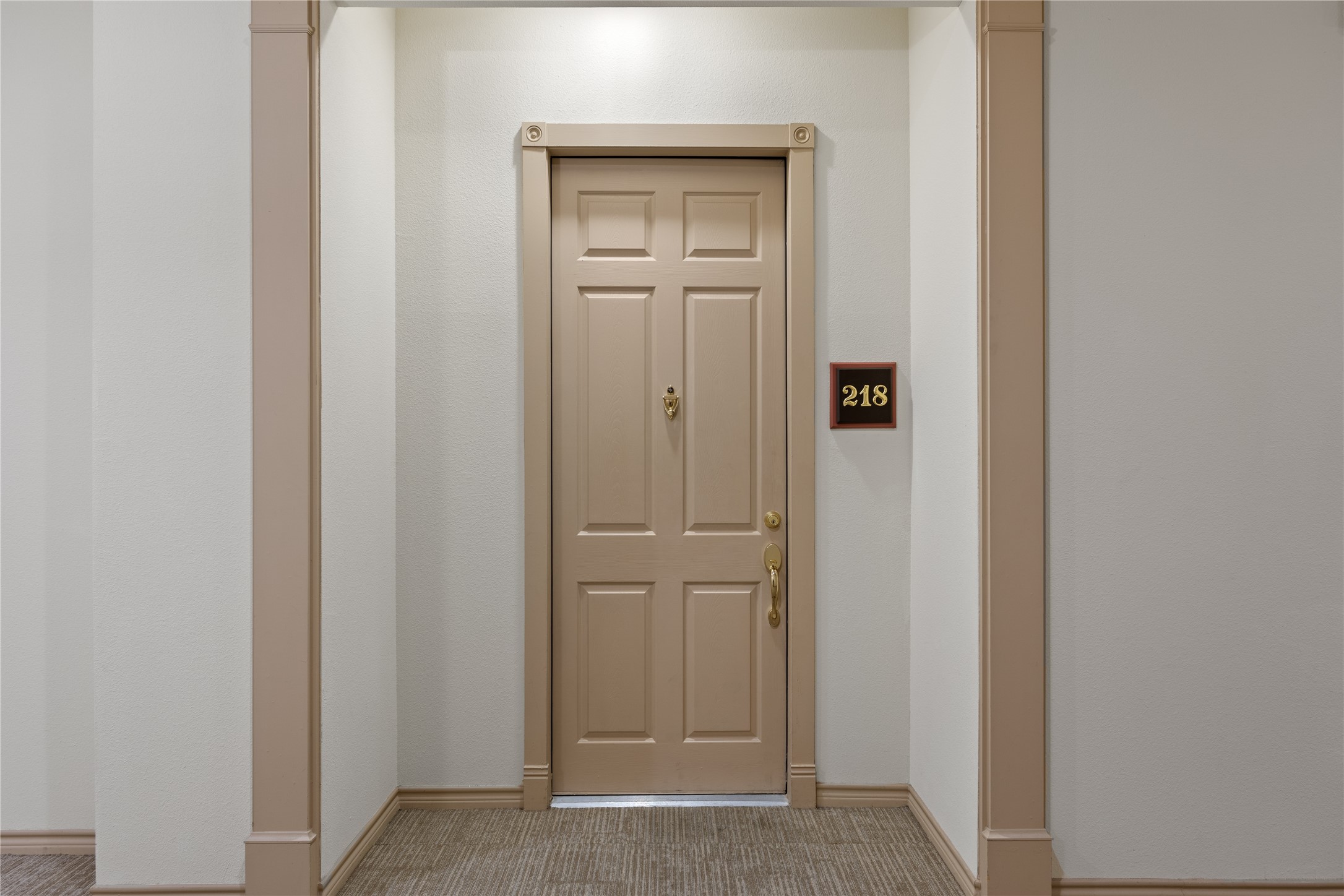 2400 McCue Road, Unit 218 Houston, TX 77056 - Photo 15 of 16 located close to elevators in interior enclosed hallways.