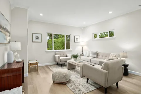 a living room with furniture and a rug