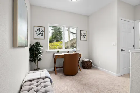 a spacious bedroom with a bed and a cabinets