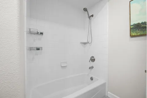 a bedroom with bed and a window