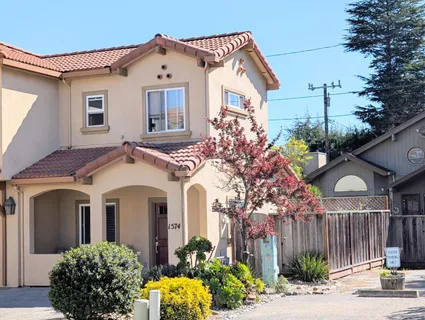 a view of balcony with wooden floor and outdoor seating