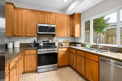 a kitchen with a sink and a window