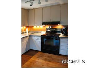 3967 Bald Creek Road Clyde, NC 28721 - Photo 3 of 13 a kitchen with granite countertop a stove and a sink