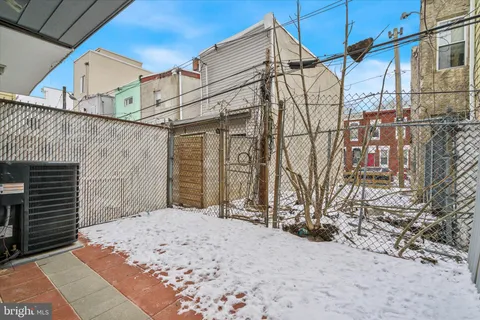 a view of a house with a snow in the background