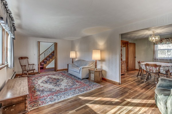 24 Station Road Salem, MA 01970 - Photo 3 of 25 a living room with furniture and a wooden floor