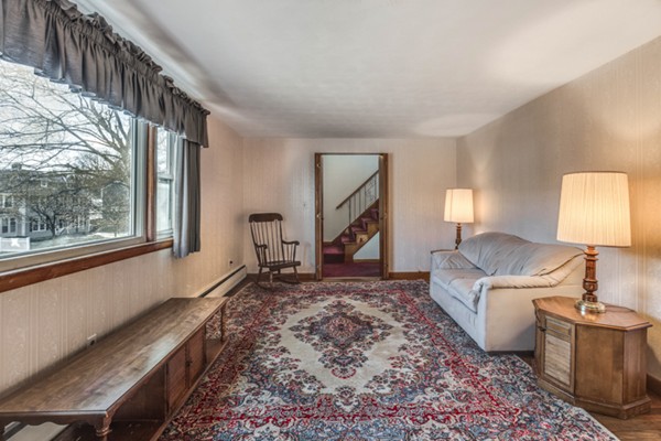 24 Station Road Salem, MA 01970 - Photo 5 of 25 a living room with furniture and a window