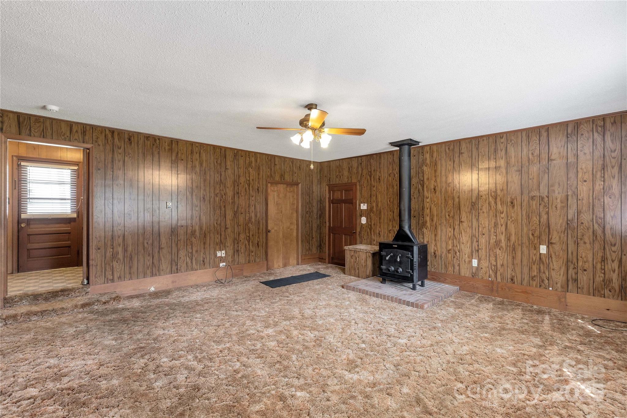 1967 Roland Williams Road Lancaster, SC 29720 - Photo 3 of 27 wooden floor in an empty room with a window
