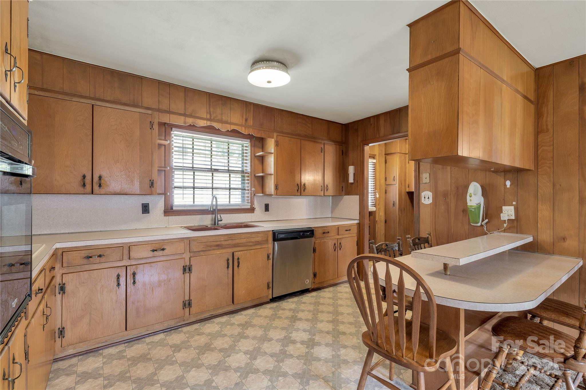 1967 Roland Williams Road Lancaster, SC 29720 - Photo 6 of 27 a kitchen with a table chairs sink and cabinets