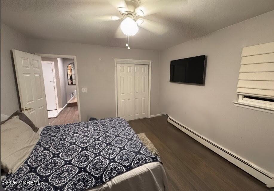 151 Wyckoff Road Eatontown, NJ 07724 - Photo 2 of 17 a bedroom with a bed and a flat screen tv