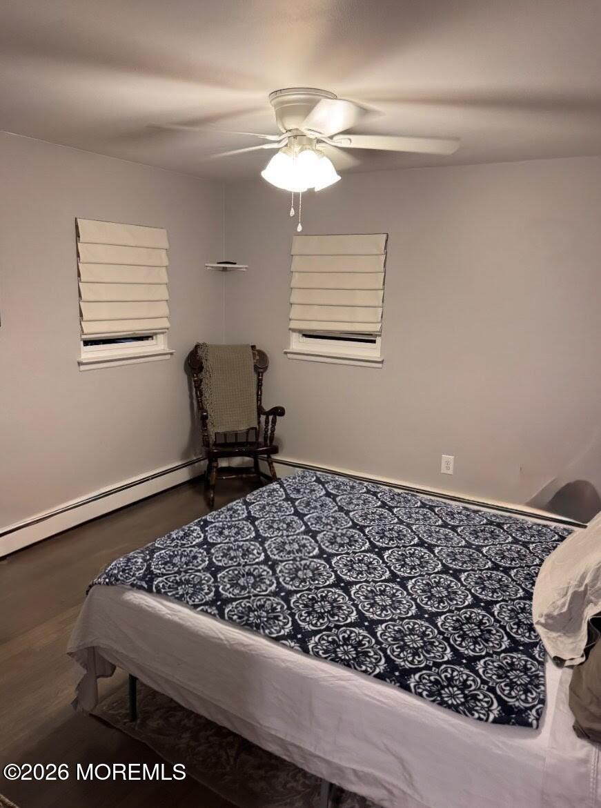 151 Wyckoff Road Eatontown, NJ 07724 - Photo 3 of 17 a bedroom with a bed and a window