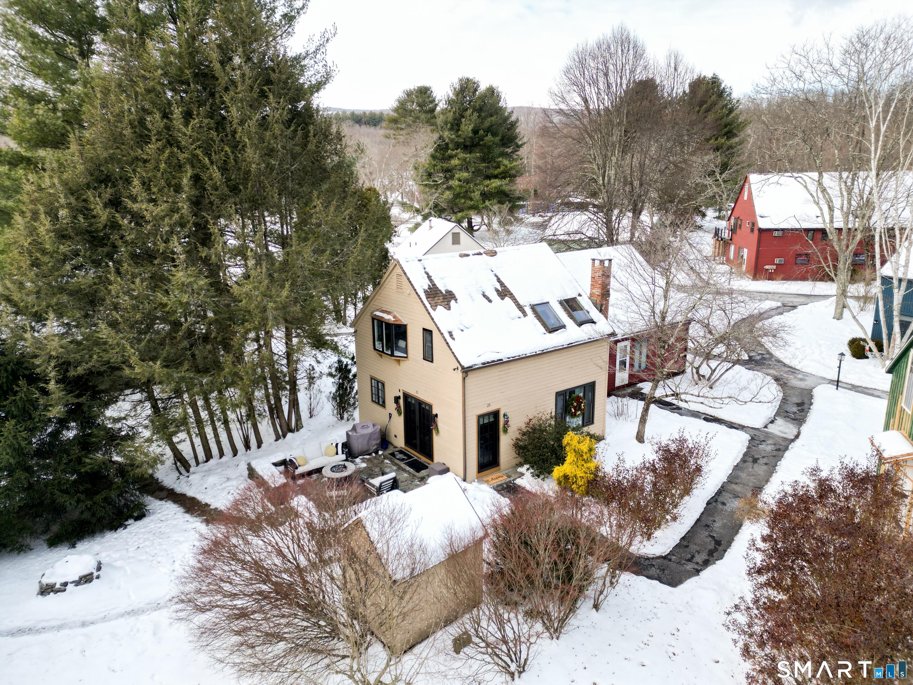 a view of a house with backyard and sitting area