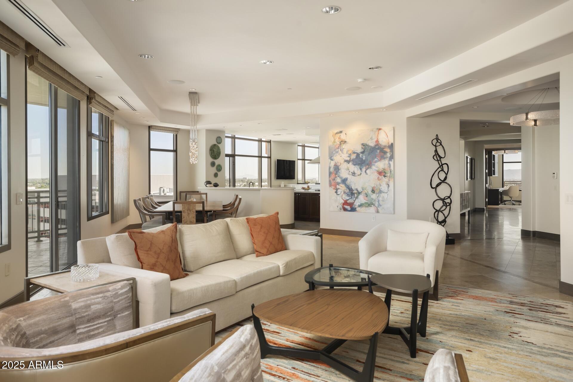 2211 East Camelback Road, Unit 1203 Phoenix, AZ 85016 - Photo 13 of 39 a living room with furniture and a large window