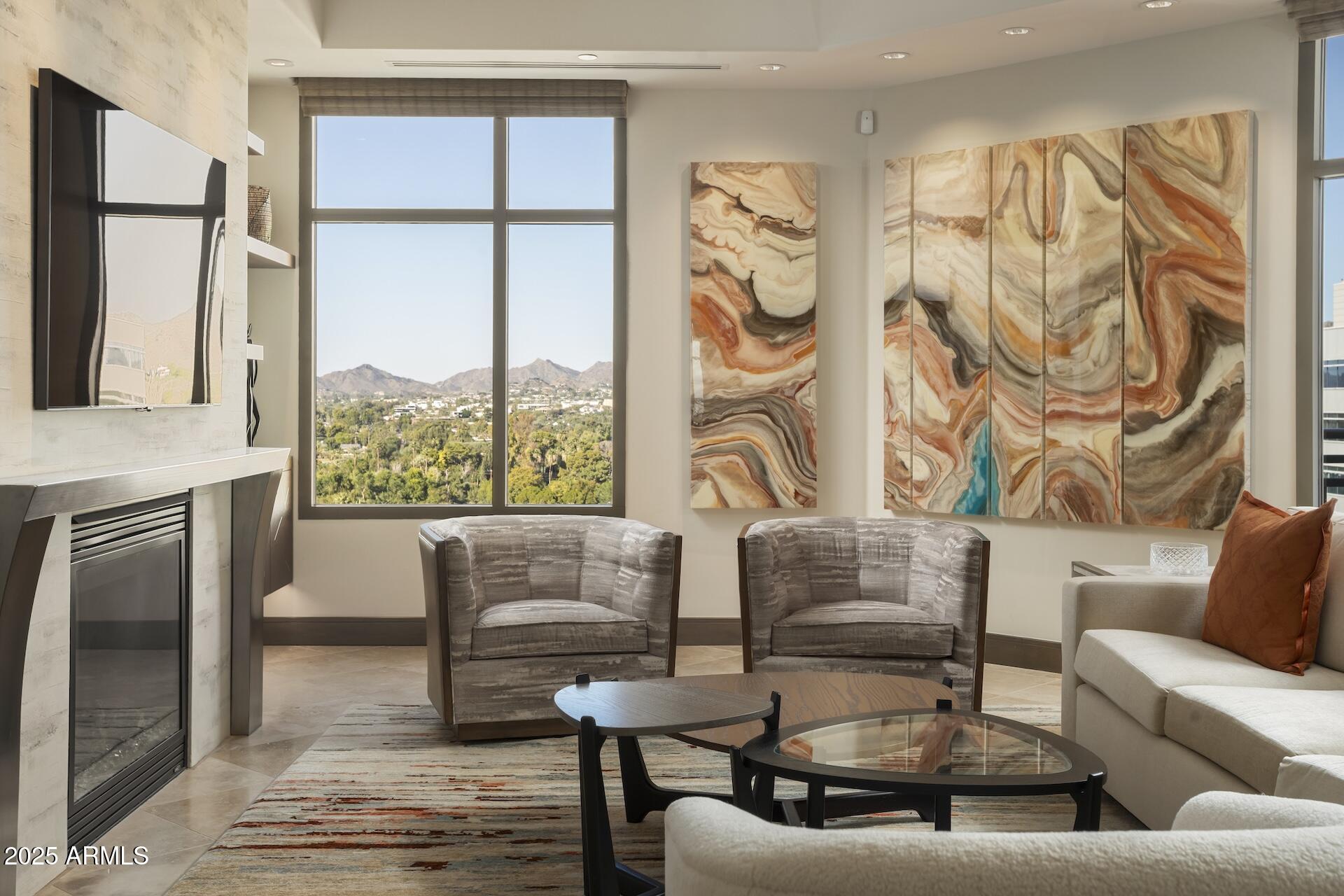2211 East Camelback Road, Unit 1203 Phoenix, AZ 85016 - Photo 15 of 39 a living room with furniture and a floor to ceiling window